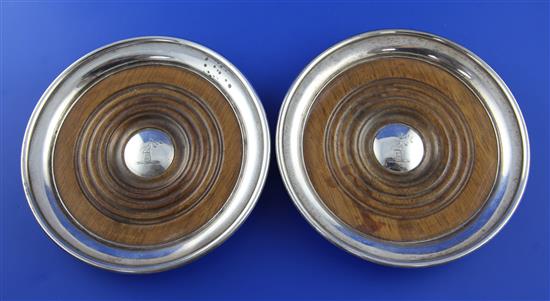 A pair of George III silver wine coasters, 6.25in.